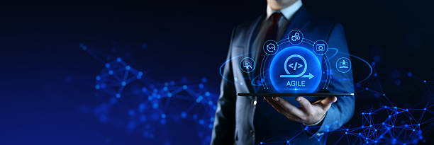 istock Businessman Holding Smartphone with Agile Development Icons on Screen. Software Development Concept 2218484228