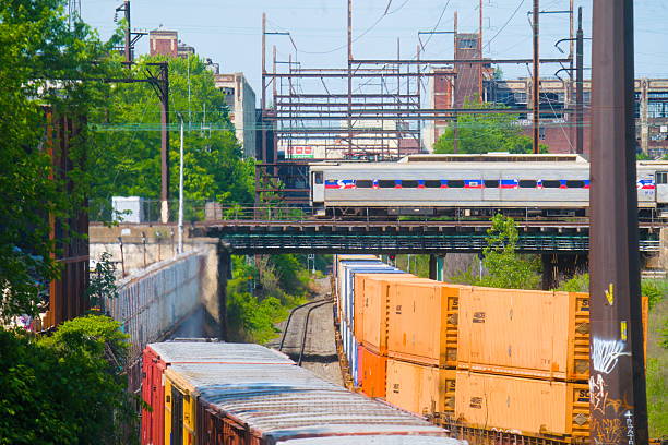 Container train in the track shipping yard. Cargo train moving in the container terminal. Freight Train Car Block Assembly in Container Terminal