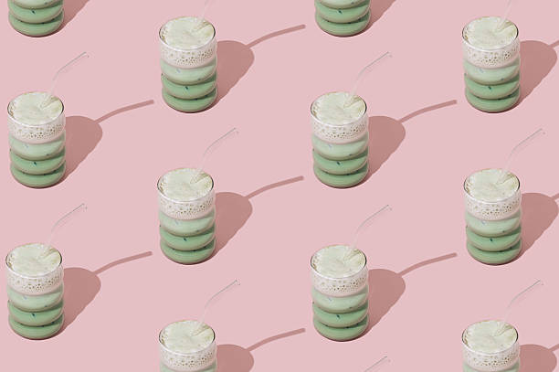 istock Creative summer pattern made of iced matcha latte on pastel pink background. Minimal healthy matcha latte concept. Trendy drink idea. 2218486366