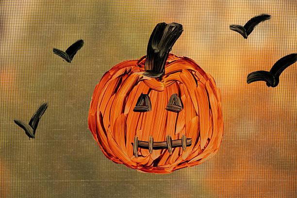 istock Pumpkin drawing on window as Halloween decoration in apartment 2218488176