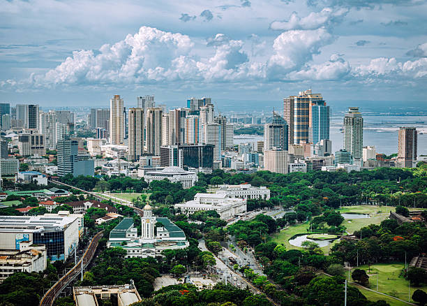 Panoramic View of Manila's Skyline Featuring Parks and Modern Architecture stock photo