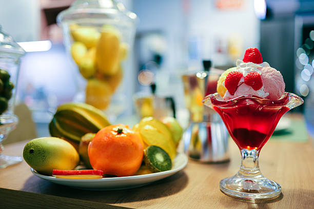 Fake fruit, dessert, ice cream still life in kitchen.