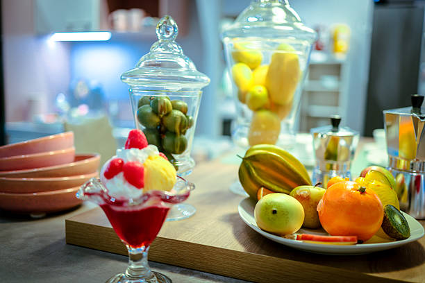 Fake fruit, dessert, ice cream still life in kitchen.