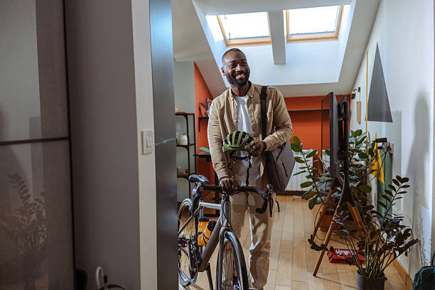 istock Man leaving home with a bicycle before commuting during the day 2218490025