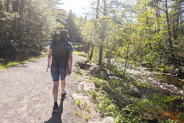 istock Man Hiking with a Backpack on a Hiking Trail in New York 2218490851