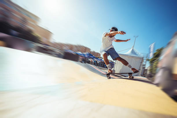 A young man performs dynamic maneuvers on a surfskate in a waveramp skate park. He rides the curves and edges with agility, dressed in casual summer attire. The photos capture the movement and energy of skate culture in an urban outdoor setting.