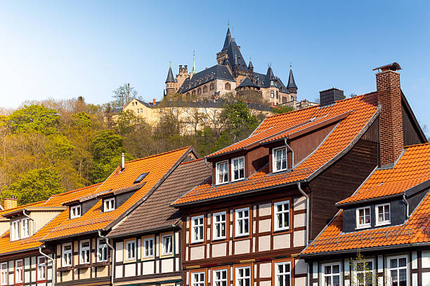 istock Half-timbered houses and Wernigerode Castle on a sunny spring day 2218493550