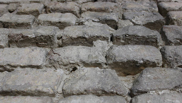 istock Antique brick stones in a rows texture background 2218494404