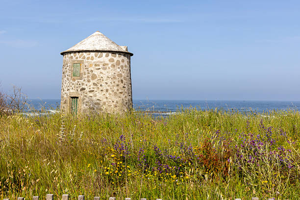 The old Mills Apulia along the dunes of the beach of Apulia - Portugal