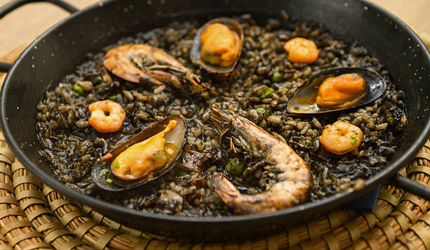 istock Paella with mussels and shrimps in a pan 2218495986