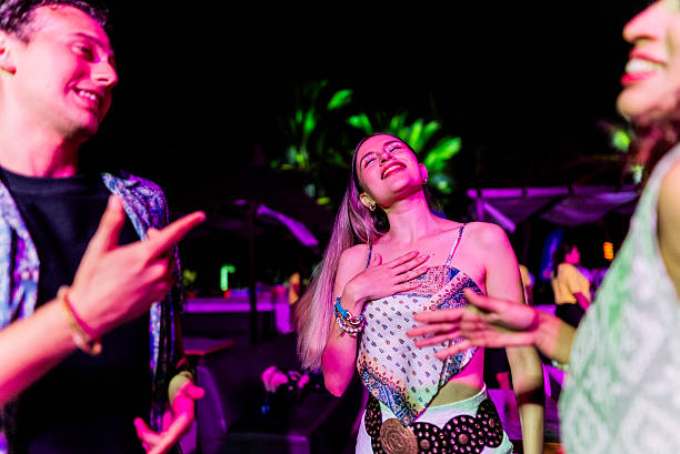 istock Young friends dancing during party outdoors 2218496138