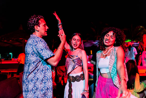 istock Young friends dancing during party outdoors 2218496139