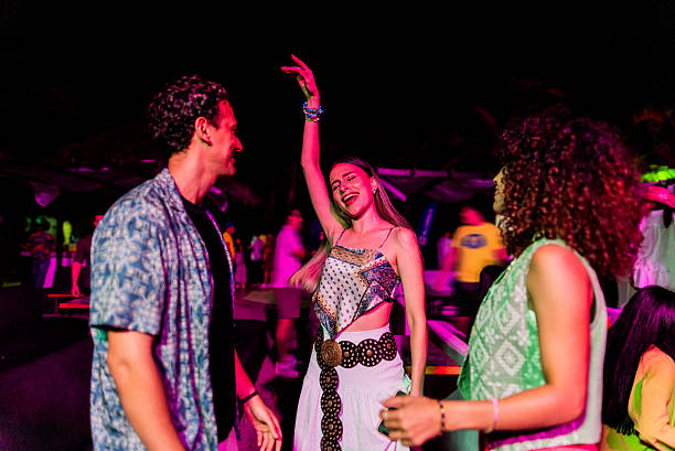 istock Young friends dancing during party outdoors 2218496140