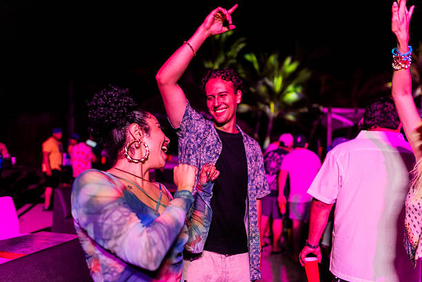 istock Young friends dancing during party outdoors 2218496242