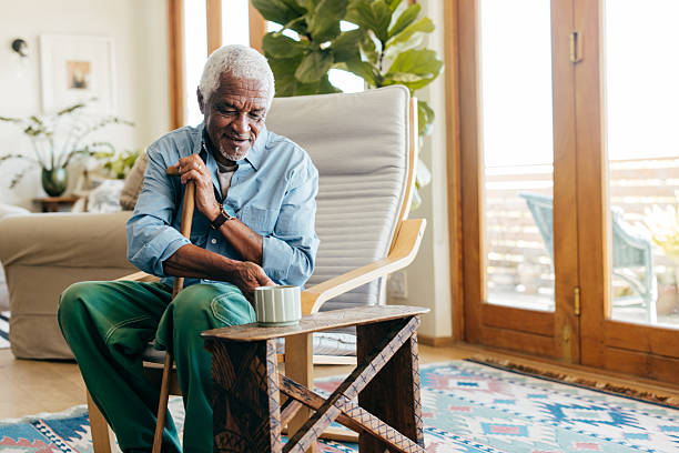 istock Resting quietly, an elderly man enjoys his tea surrounded by soft light and greenery in a warm, inviting space. 2218496373