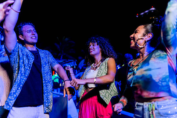 istock Young friends dancing during party outdoors 2218496409