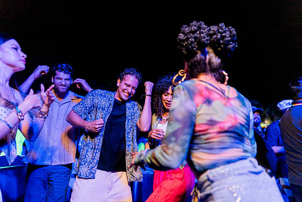 istock Young friends dancing during party outdoors 2218496410