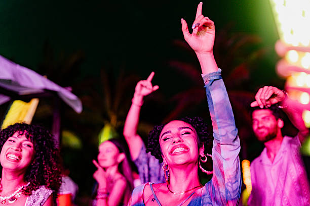 Young friends dancing during party outdoors