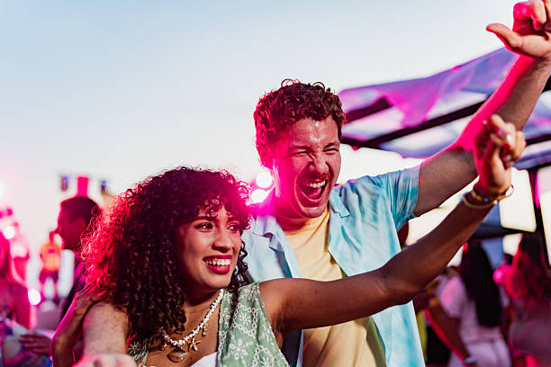 istock Young couple dancing on party outdoors 2218497627