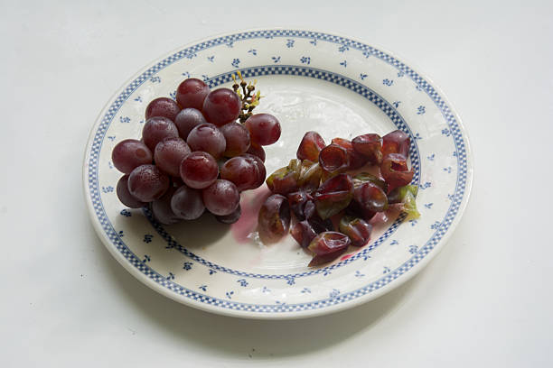 Grapes in a plate on a white background. Isolated