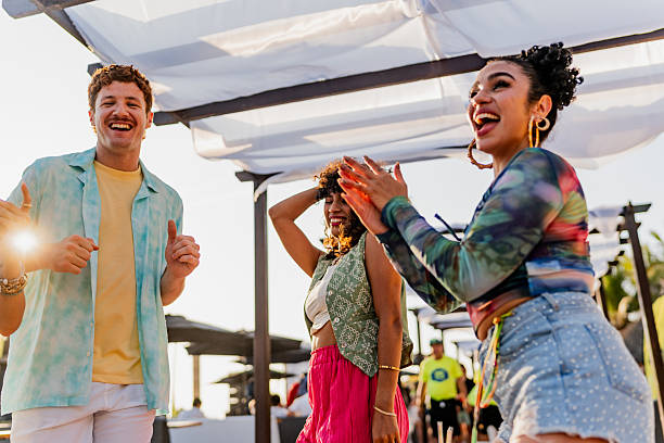 istock Young friends dancing during party outdoors 2218498691