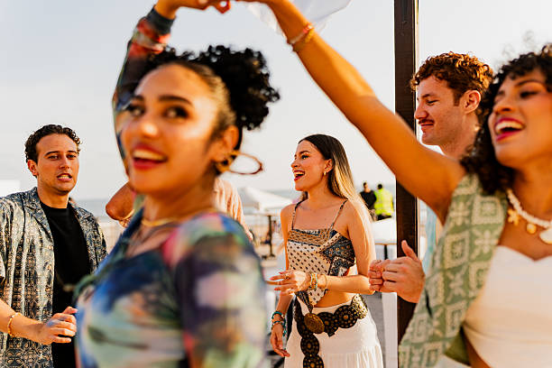 istock Young friends dancing during party outdoors 2218498748