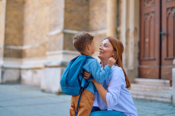 istock Mother hugging her son before going to school 2218498803