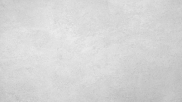 istock A grey wall with a rough texture. The wall is covered in white paint and has a grainy appearance 2218499365
