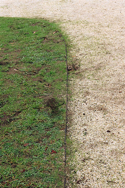 istock lawn and gravel pathway with minimal lawn edging 2218501778