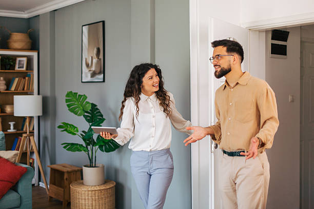 istock Real estate agent showing apartment to potential buyer using digital tablet 2218501844