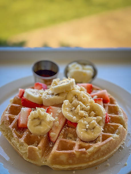 istock Waffle with strawberries and banana served for breakfast 2218503039