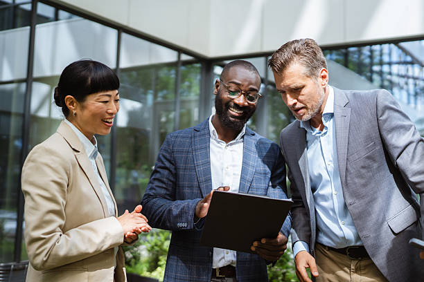 istock happy multiracial entrepreneurs businesspeople communicating 2218504384