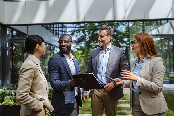 istock happy multiracial entrepreneurs businesspeople communicating 2218504411