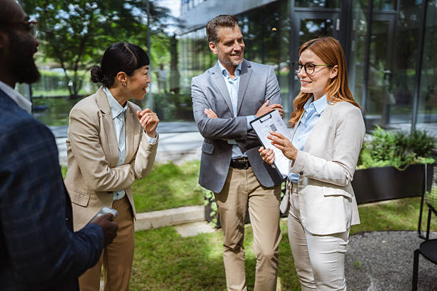 istock Caucasian businesspeople on the meeting with multicultural colleagues 2218504821