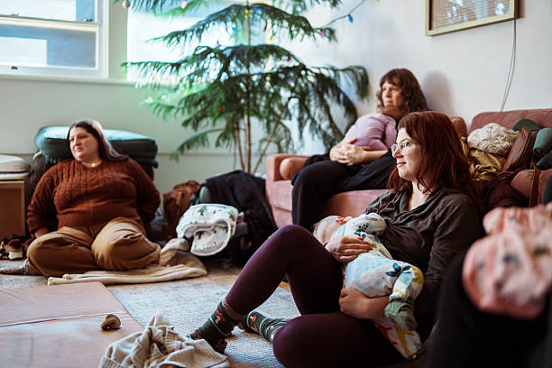 istock Woman breastfeeding baby while attending a postpartum support group 2218505720