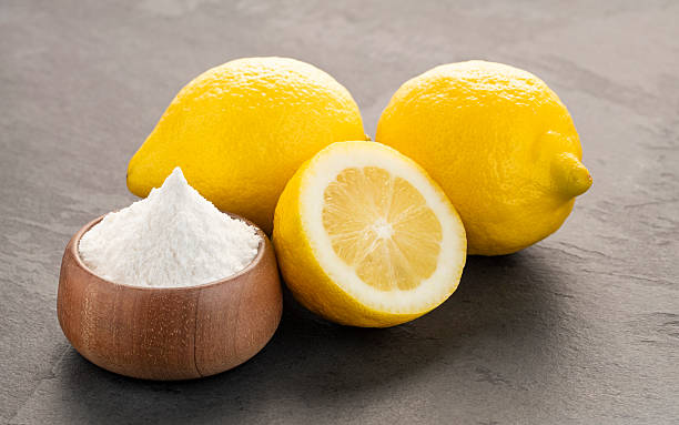 istock Yellow lemon fruit with baking soda in a bowl - Citrus Limon 2218505917