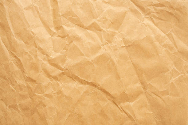 istock Abstract crumpled and creased recycle brown paper texture background 2218509353