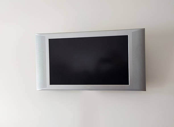 istock Modern wallmounted screen with a blank dark display. Ideal for showcasing your content, advertising, or message. Represents technology, entertainment, and connectivity. 2218510114