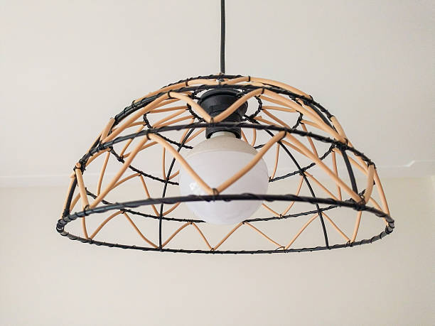 istock Stylish pendant light featuring a woven dome, showcasing natural and black materials. Ideal for home decor, design inspiration, or architectural concepts. 2218510132