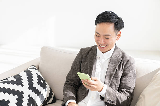 istock young man who uses smart phone 2218513162