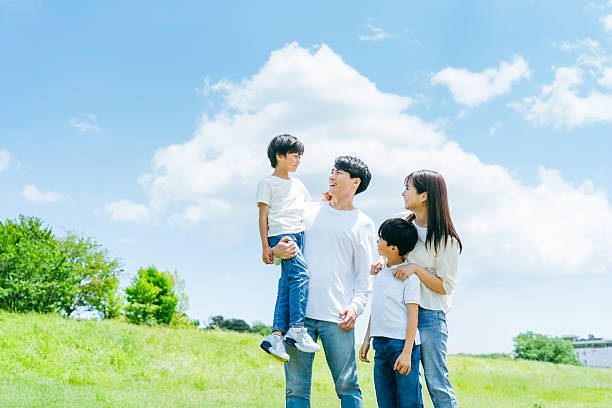 istock family playing under the blue sky 2218514193