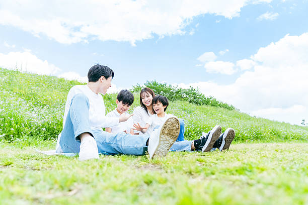 istock family playing under the blue sky 2218514232