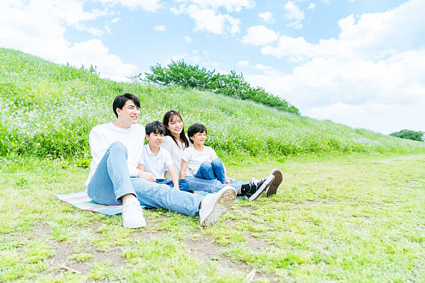 istock family playing under the blue sky 2218514271