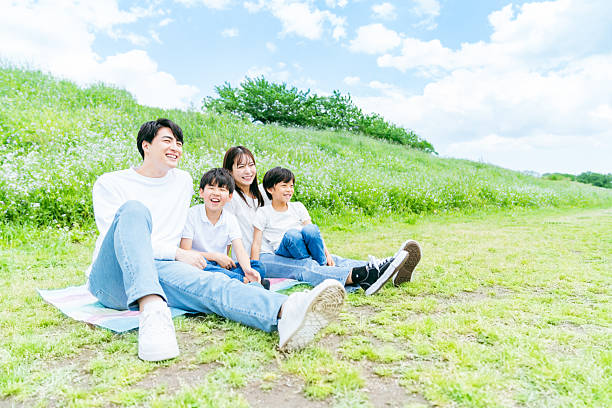 istock family playing under the blue sky 2218514273