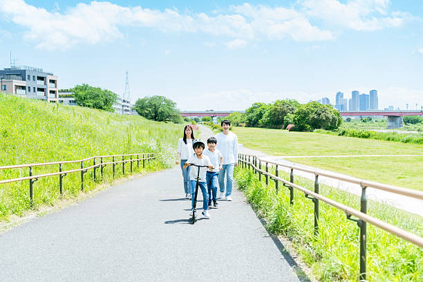 istock family playing under the blue sky 2218514288
