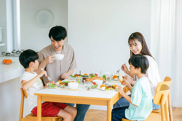 istock family eating at the dining room 2218514493