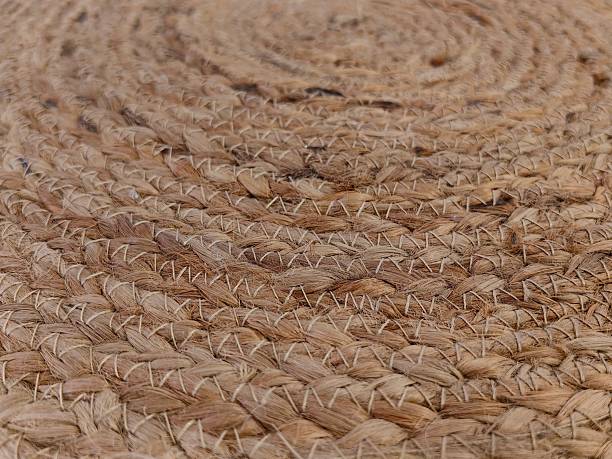 istock natural jute rug featuring intricate weaving patterns in close-up view warm home decor touch. 2218516287