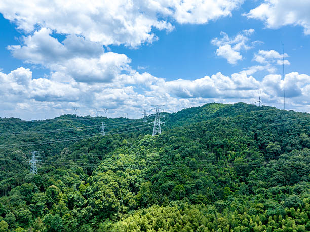 istock Mountains with blue sky and white clouds, power transmission lines 2218517437