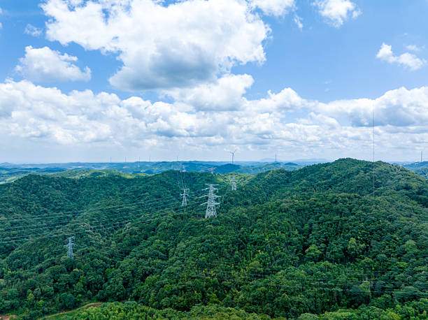 istock Mountains with blue sky and white clouds, power transmission lines 2218517460