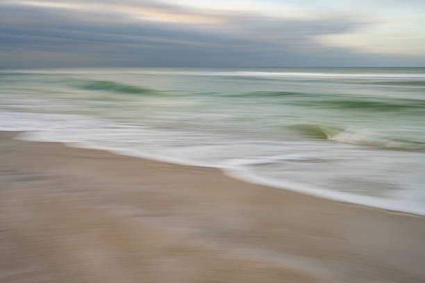 istock Slow down time at the beach with gentle ocean waves 2218517848